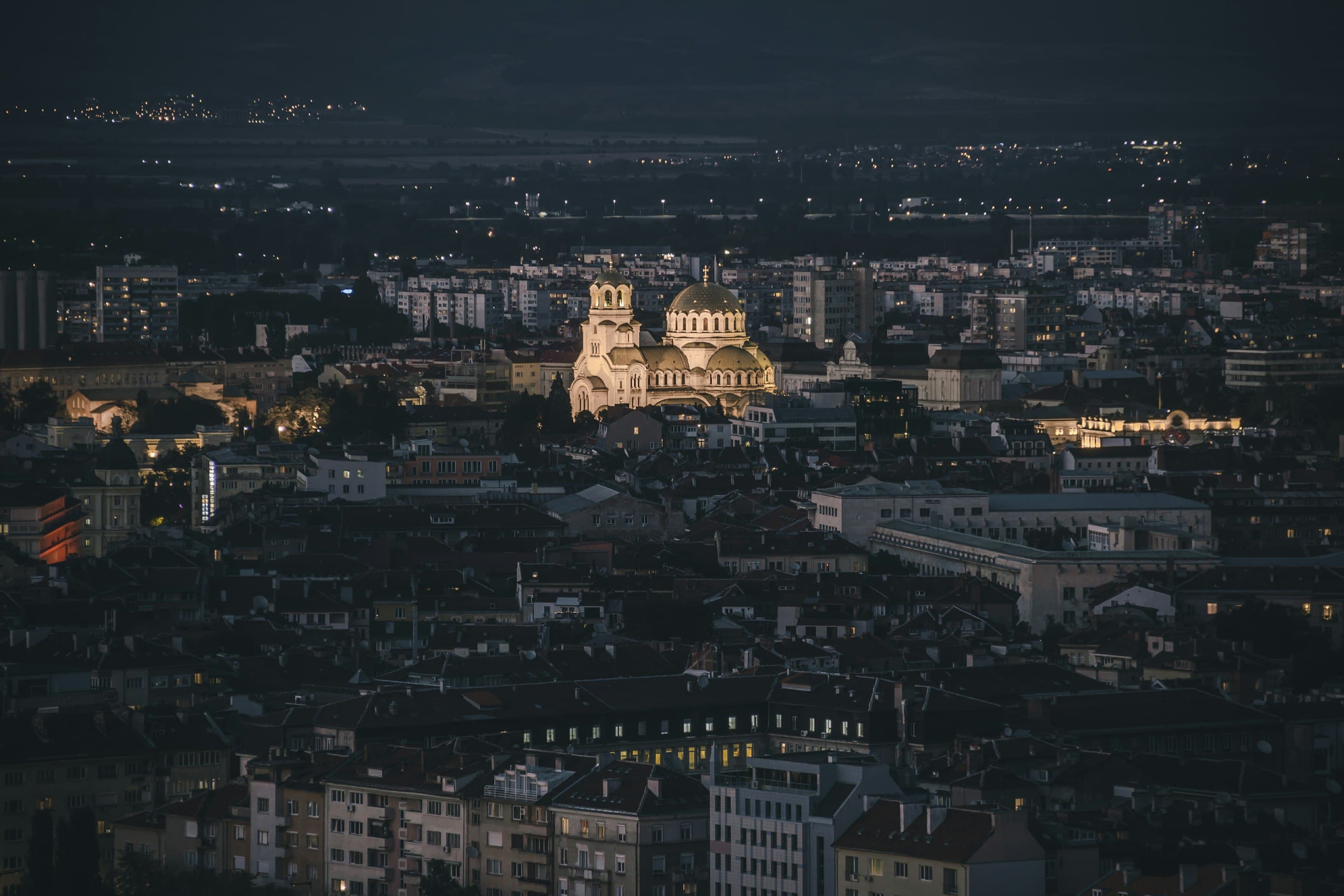 Sofia at night, with the Alexander Nevsky Cathedral lit at the centre of the city.